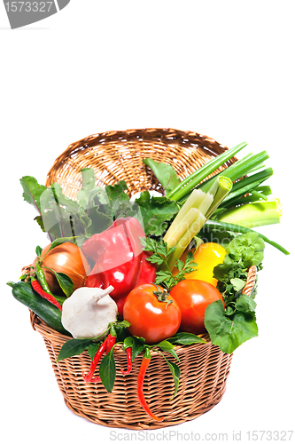 Image of Fresh vegetables in basket isolated on white 