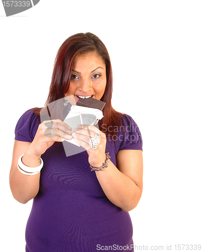 Image of Girl eating chocolate.