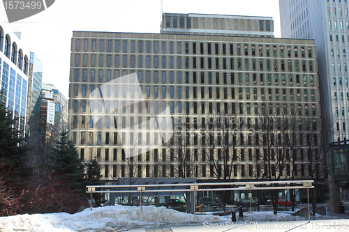 Image of Building seen from the street with snow in the yard