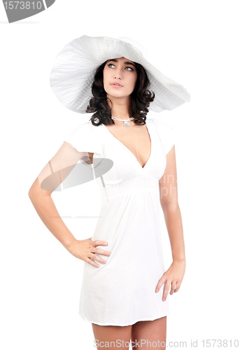 Image of young woman in white dress and hat