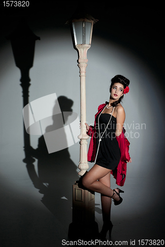Image of young woman and lightpole