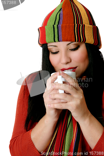 Image of Woman drinking a hot drink