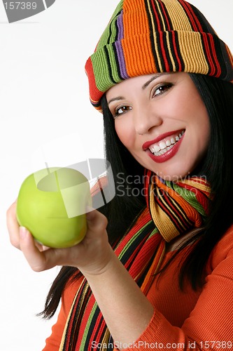 Image of Female holding a fresh green apple
