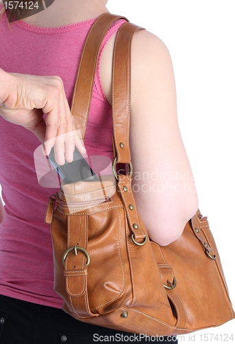 Image of Pickpocketing a mobile out of a handbag