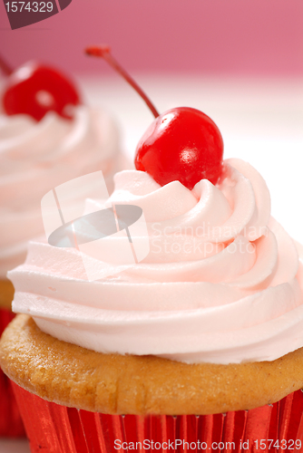 Image of Vanilla cupcake with maraschino frosting and cherry