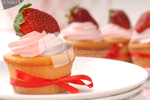 Image of Delicious Vanilla cupcake with strawberry frosting