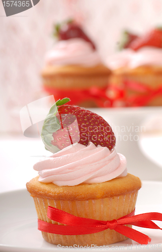 Image of Delicious Vanilla cupcake with strawberry frosting