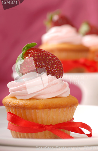 Image of Delicious Vanilla cupcake with strawberry frosting