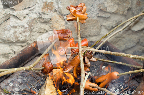 Image of outdoor grilling sausages