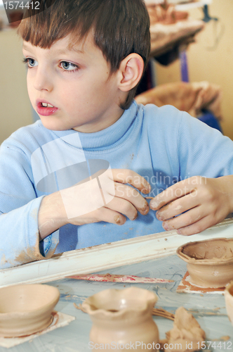 Image of shaping clay kid
