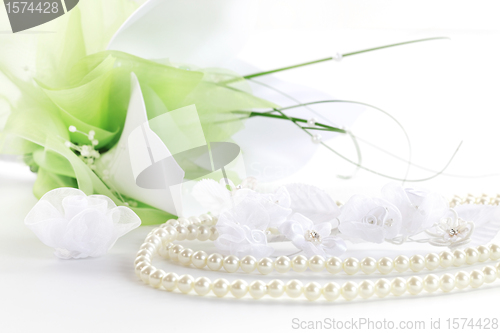 Image of Wedding still life with necklace and bouquet 