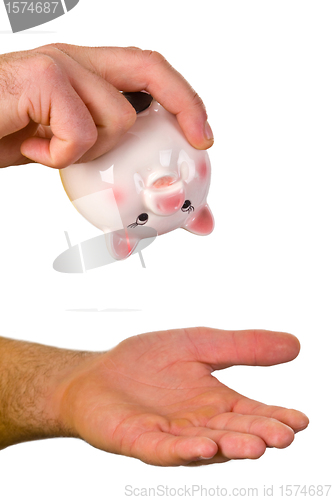 Image of Hand hold an empty piggy bank