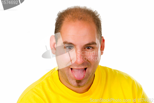 Image of Young man put out his tongue