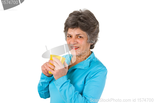 Image of Senior woman drinking coffee or tea 