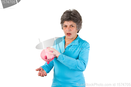 Image of Senior woman with empty piggy bank