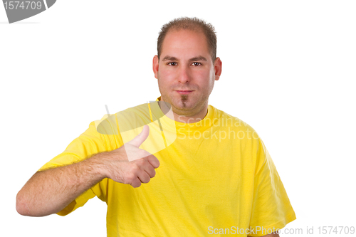 Image of Casual young man showing thumb up