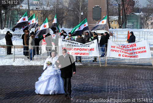 Image of Newly Married Couple and Syrian Protesters