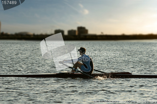 Image of Rowing alone at sunset