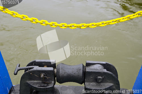 Image of Ferry berthing mechanism yellow chain background 