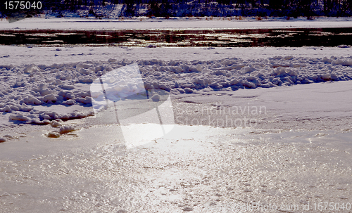 Image of frozen but still flow river floe snow water 