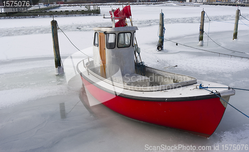 Image of Tiny fishing boat in ice