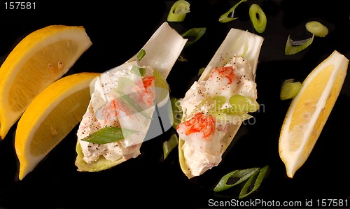 Image of Crab salad on endive leaves with lemon