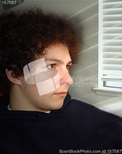 Image of Boy sitting by the window