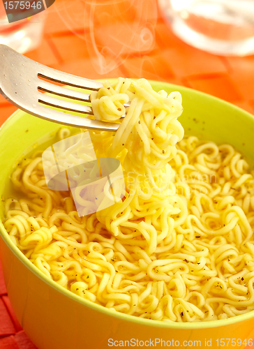 Image of Hot and tasty noodles on a plug.