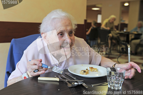 Image of senior woman eating