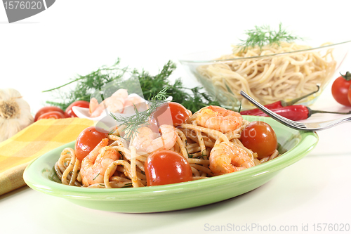 Image of freshly cooked spaghetti with shrimp and dill