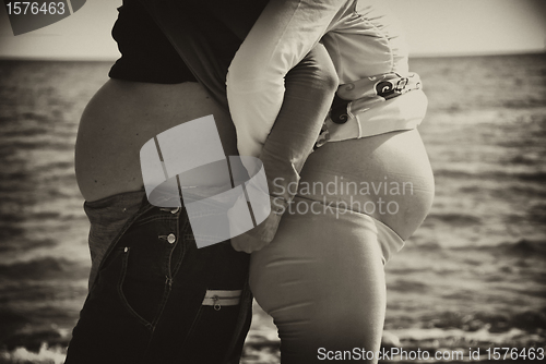 Image of Two Pregnant Women relaxing at the Beach in Italy