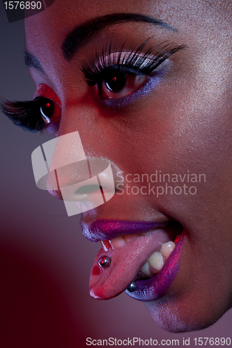 Image of African Woman With Tongue Piercing