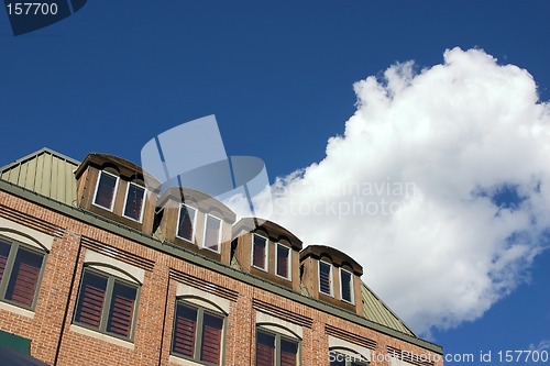 Image of Close up on an Old Building with Cloudy Background