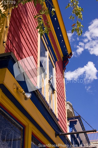 Image of Close up on an Old Colorful Building with Cloudy Background