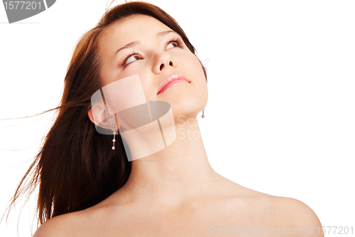 Image of Young dreamy woman looking up