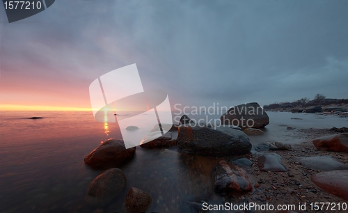 Image of Sunset in a calm bay