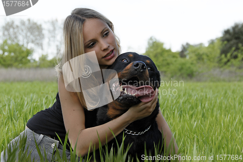 Image of rottweiler and teenager