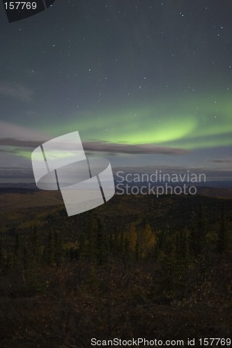 Image of Moon lit sky with aurora over fall colors