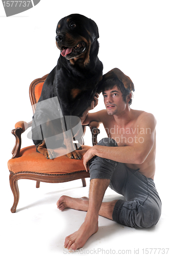 Image of rottweiler and man