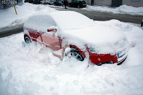 Image of red car in snow