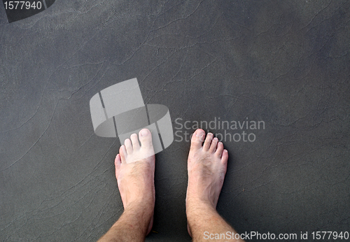 Image of barefoot man on sea 