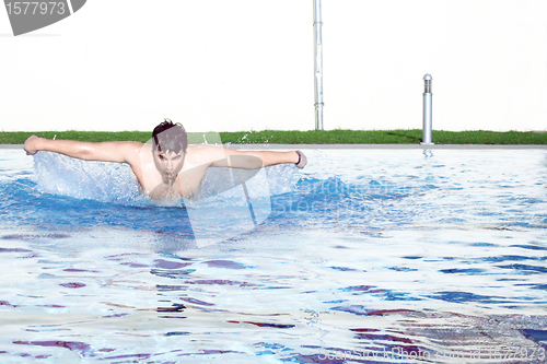 Image of a butterfly swimmer in pool