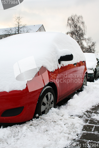 Image of red car in the winter on the road