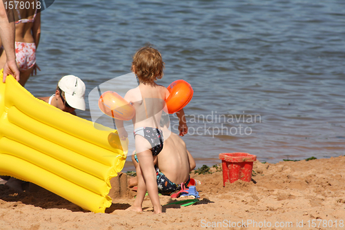 Image of mother-child play with the sand
