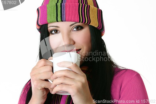 Image of Woman drinking from mug