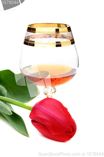 Image of Brandy and flower on a white background. 