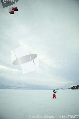 Image of Flying a kite in winter