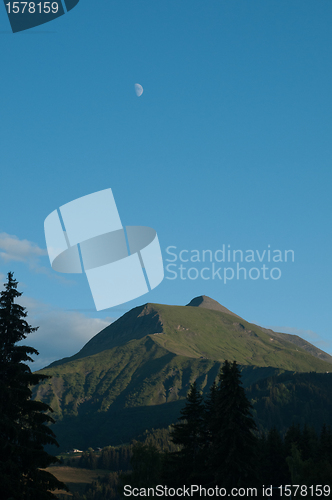 Image of The moon on the top of the The Mont Joly (France - Savoie)