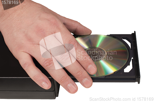 Image of Hand placing a CD in a drive tray (2/3)