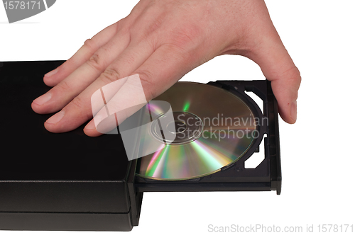 Image of Hand placing a CD in a drive tray (3/3)